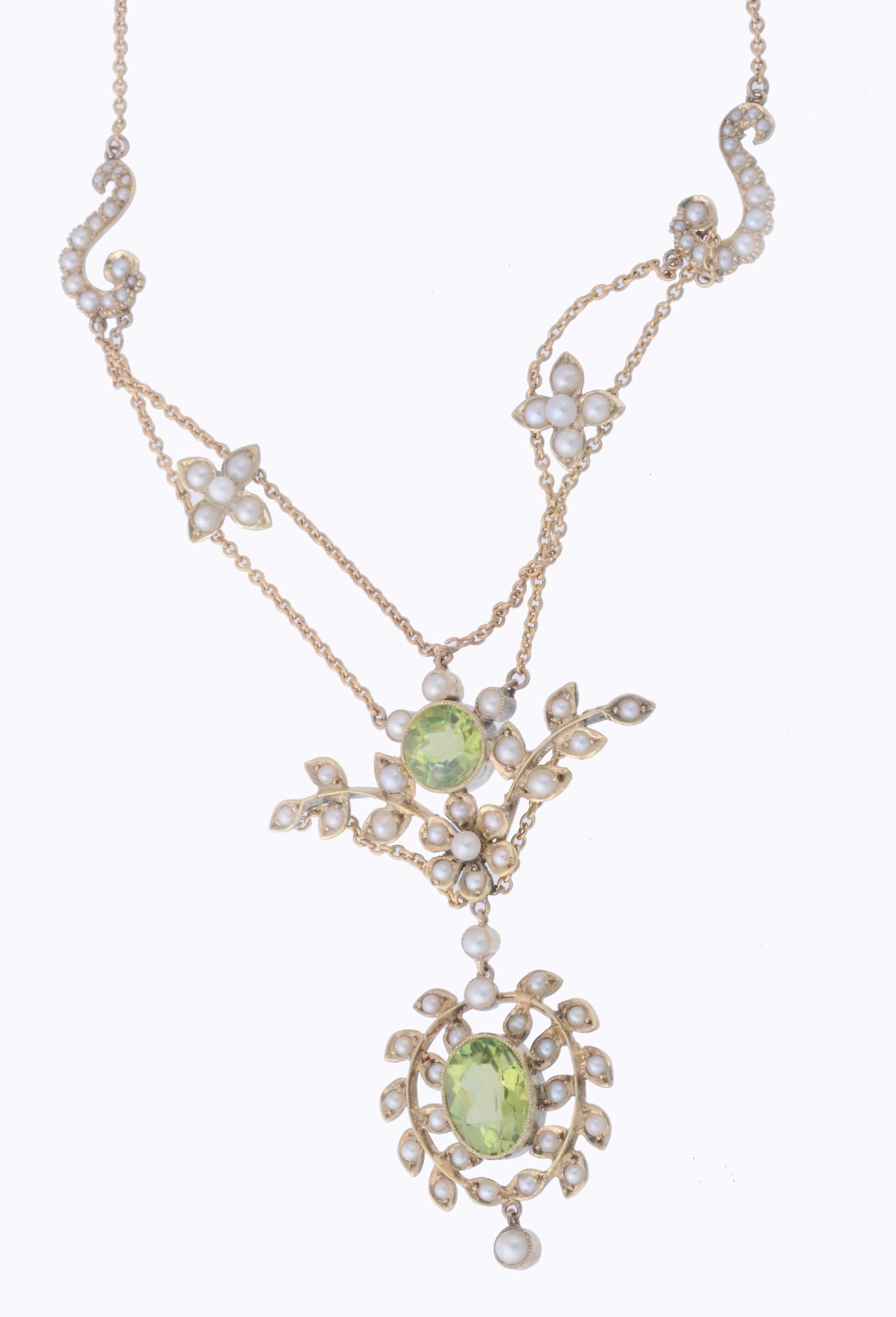 A peridot and seed pearl necklace, the oval shaped peridot within an...  A peridot and seed pearl