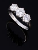 A three stone diamond ring, the ring with graduated brilliant cut diamonds  A three stone diamond