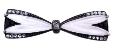 An Austrian Art Deco diamond bow brooch, circa 1930, and onyx bow brooch  An Austrian Art Deco