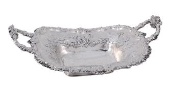 A George IV silver twin handled shaped rectangular fruit dish by Kirkby, Waterhouse & Co.,