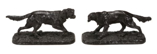 A pair of 19th century bronze retriever dogs on naturalistic bases - appear unsigned