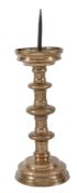 A brass pricket candlestick