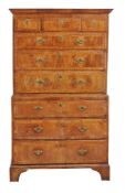 An early 18th century walnut and crossbanded chest on chest,
