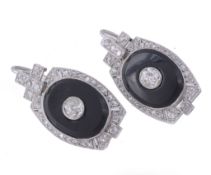 A pair of onyx and diamond ear pendents, the oval panels of onyx set with a...  A pair of onyx and