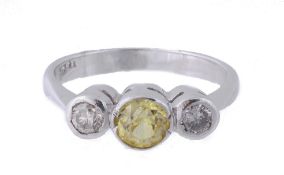 A yellow sapphire and diamond ring, the central yellow sapphire between two...  A yellow sapphire