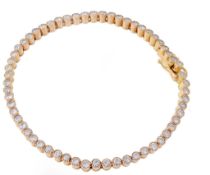 A diamond line bracelet, the articulated bracelet composed of circular links...  A diamond line