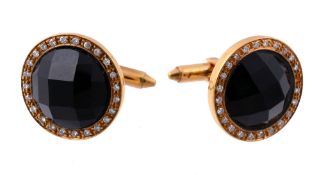 A pair of onyx and diamond cufflinks, the circular shaped faceted onyx...  A pair of onyx and
