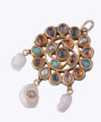 A Jaipur enamelled gem set pendant, the pierced circular panel set with...  A Jaipur enamelled gem