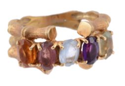 A multi gem ring, the oval cut stones including amethyst  A multi gem ring,   the oval cut stones