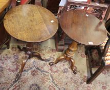 A Georgian oak circular top tripod table and a Victorian walnut tripod table with later mahogany top