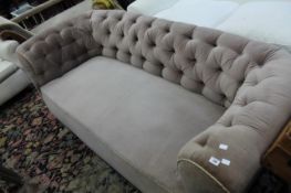 A mahogany and upholstered chesterfield sofa, early 20th Century of typical form 208cm wide