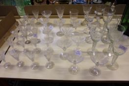 A quantity of drinking glasses with engraved bowls