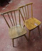 A mixed lot of chairs to include a pair of spindle chairs, a pair of Windsor chairs and three