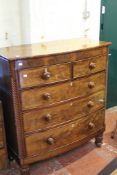 A Victorian mahogany bow front chest of drawers with carved decoration 109cm wide