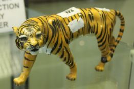 A Beswick model of a tiger, 22cm long.