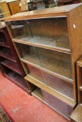 A Schreiber open rosewood style bookcase 177cm high, 107cm wide and another bookcase with adjustable