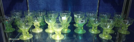A suite of green glass Roemers, with round bowls, on prunted hollow stems and circular bases, 9cm