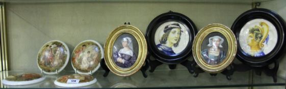 A pair of maiolica circular dishes, one decorated with portrait of Alexander the Great, the other
