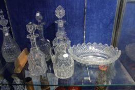Four glass decanters with stoppers and an Irish cut glass bowl, oval, 32cm wide (5)