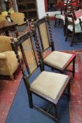 A set of six 17th Century style oak high back dining chairs with cane backs