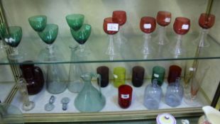 A quantity of drinking glasses with coloured bowls and other glassware
