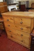 A Victorian pine chest of drawers with three long drawers.