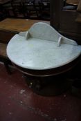 A Victorian mahogany demi lune table with a marble top 90cm wide