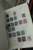 Quantity of Worldwide stamps in green album, a Bounty stamp album and some loose sheets  Best Bid