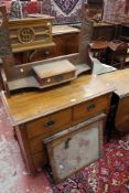 An Edwardian walnut dressing table chest with mirror back and two short and two long drawers