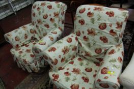 A pair of upholstered armchairs with poppy decorated covers  Best Bid
