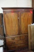 A 19th Century mahogany linen press with beaded panelled doors over drawers to the base.200cm h x