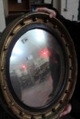 * A Regency style gilt framed circular wall mirror