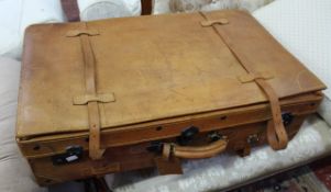 Three graduated leather suitcases the largest 50 x 83cm