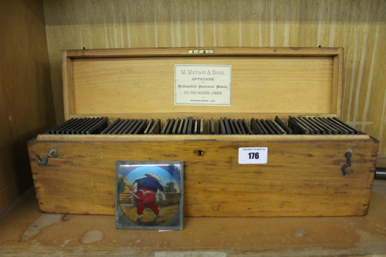 A quantity of magic lantern slides for children`s story telling in pine box.
