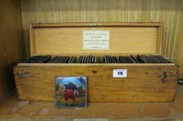 A quantity of magic lantern slides for children`s story telling in pine box.