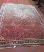 A North West Persian carpet decorated profusely with geometric motifs 358 x 265cm