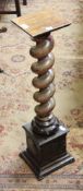 A walnut torchere with spiral twist column on pedestal base 86cm high  Best Bid