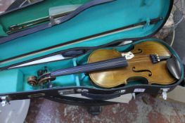 A violin with bow and case together with a child`s smaller violin with bow and case (2)