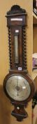A Victorian burr walnut mercury wheel barometer, the 9.5inch circular silvered register signed `