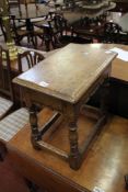 An oak octagonal table and a 17th century style oak joined stool