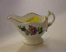 An English porcelain small cream jug painted with floral sprays, scroll handle, circa 1770, 6.5cm