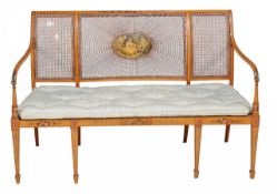 A Sheraton Revival caned sofa late 19th/early 20th Century painted with flowers the back with oval