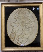 A George III silk work map of Ireland by E. Ferguson, dated 1803, 42cm x 34cm, oval, in a verre