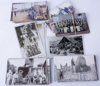 A collection of approximately eighty five Great War period postcards, real photographic and printed,