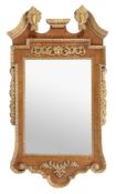 A walnut and parcel gilt wall mirror in George III style, first half 20th century, the rectangular