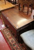 A Regency mahogany pembroke table with a frieze drawer