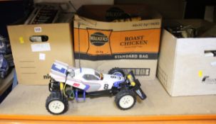 A quantity of loose, built or partially built radio controlled cars and motor bikes and some loose