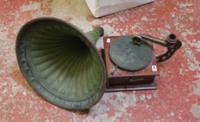 A Beltona mahogany cased gramophone record player with a bottle green horn.