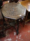 An octagonal topped carved occasional table with an Edwardian example
