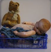 An Armand Marseille `My Dream Baby` bisque socket head doll, composition body and limbs, with blue